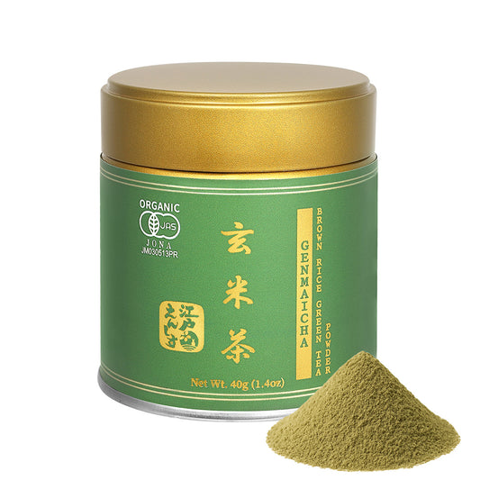 Genmaicha powder in a green resealable tin with a gold lid, shown with a small pile of the powder on a white background.