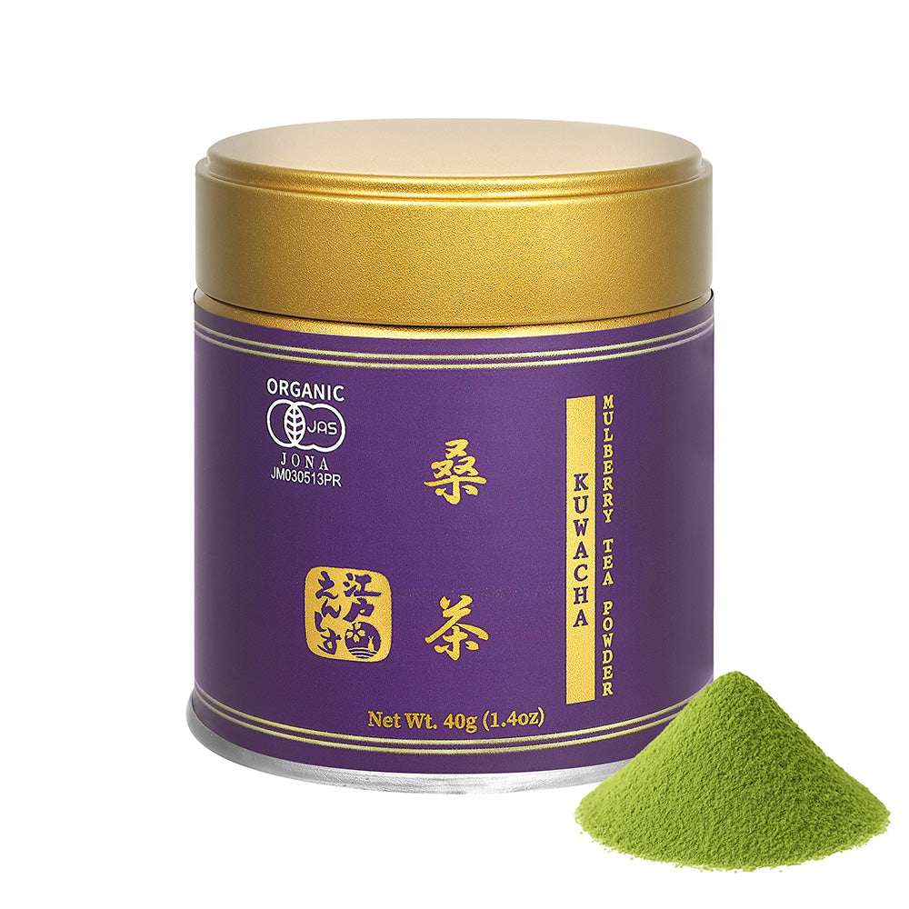 Kuwacha mulberry leaf tea powder in a purple resealable tin with a gold lid, shown with a small pile of the powder on a white background.