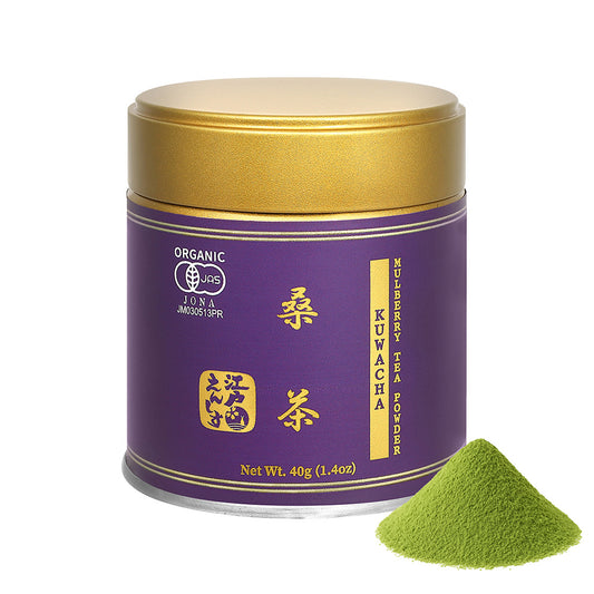 Kuwacha mulberry leaf tea powder in a purple resealable tin with a gold lid, shown with a small pile of the powder on a white background.