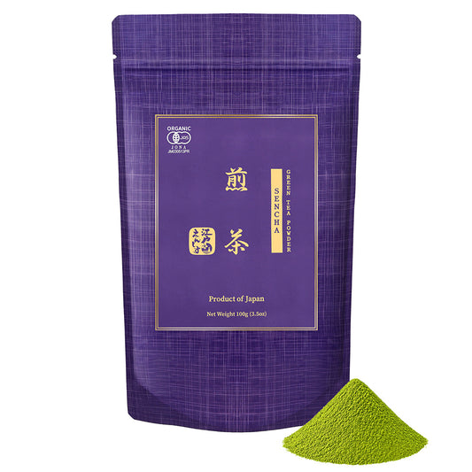Sencha powder in a blue and purple resealable stand-up pouch, shown with a small pile of the powder on a white background.